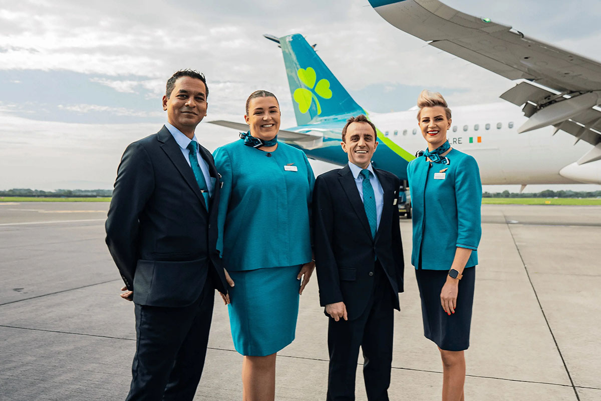 Aer Lingus Cabin crew posing by plane