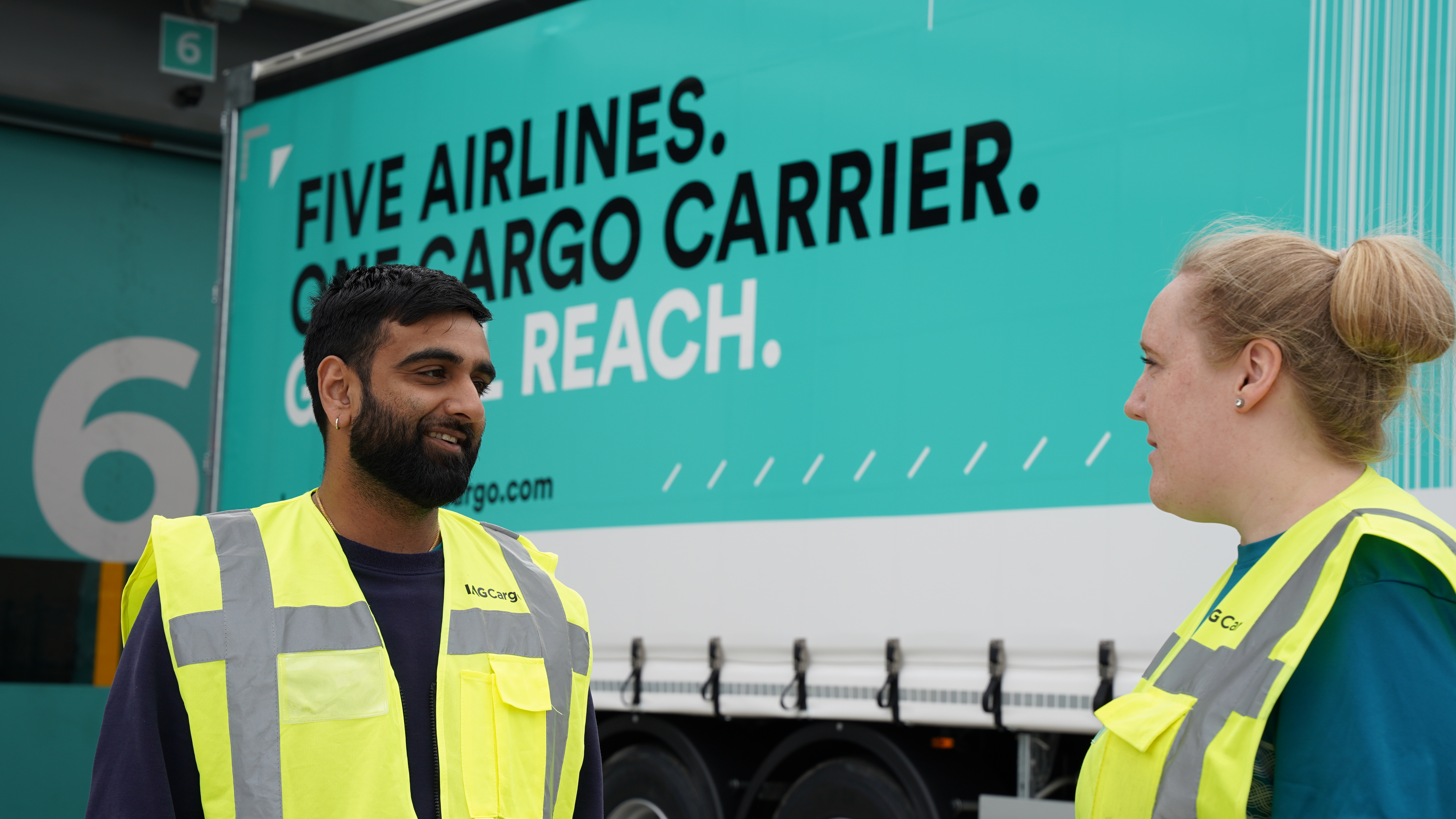 IAG Cargo staff standing near truck 2