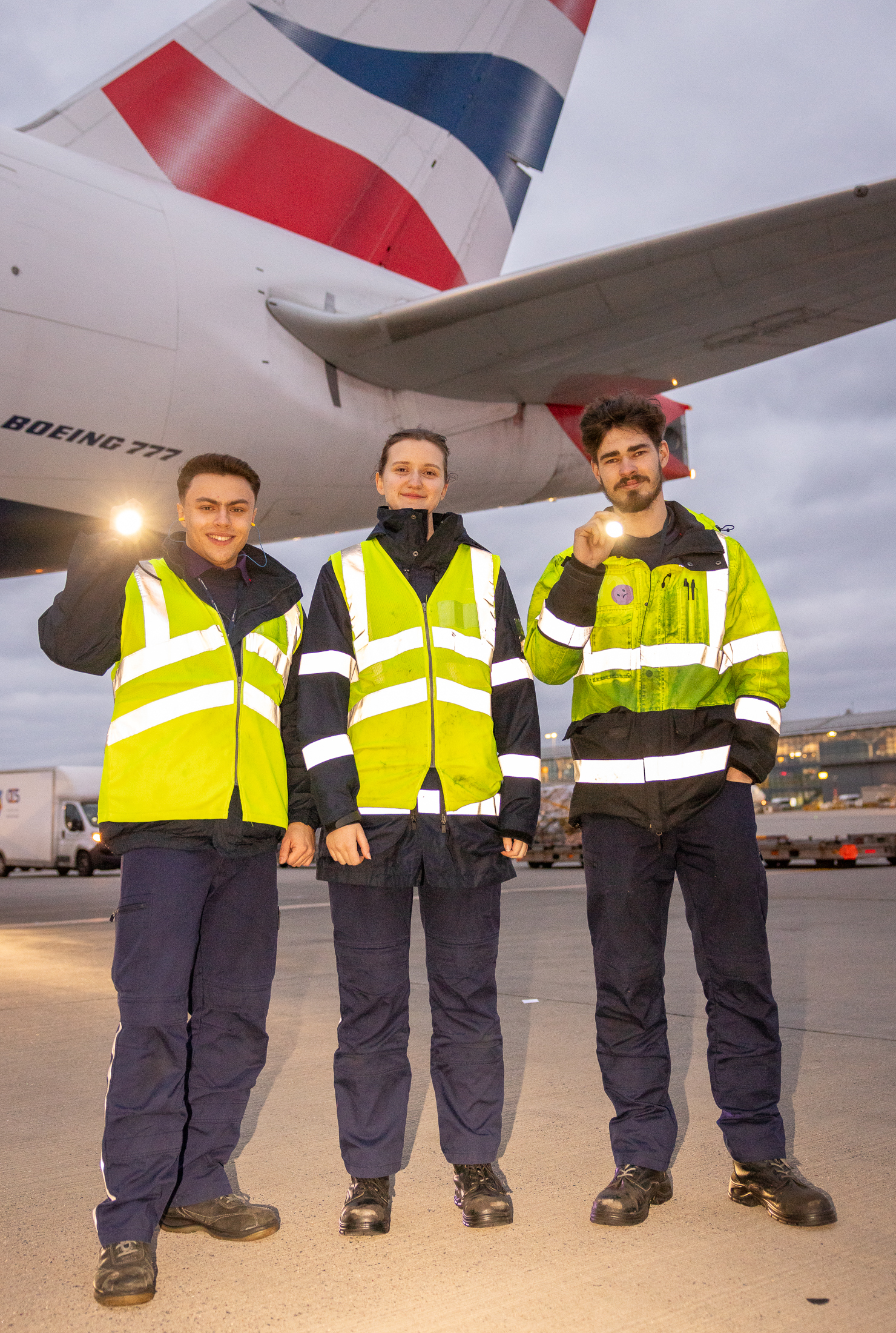 British Airways engineering apprentices pose in front of plane