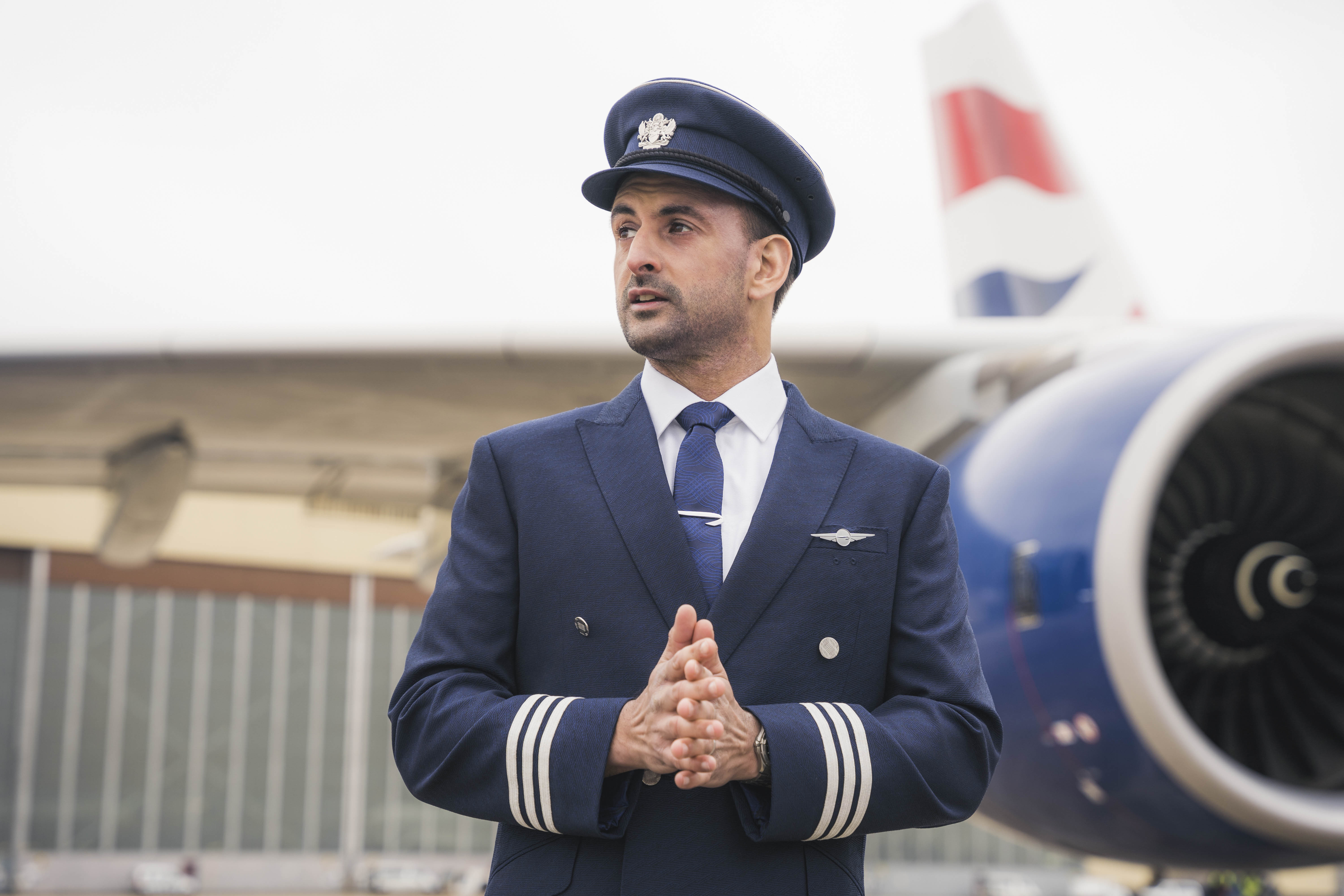 British Airways pilot in front of plane