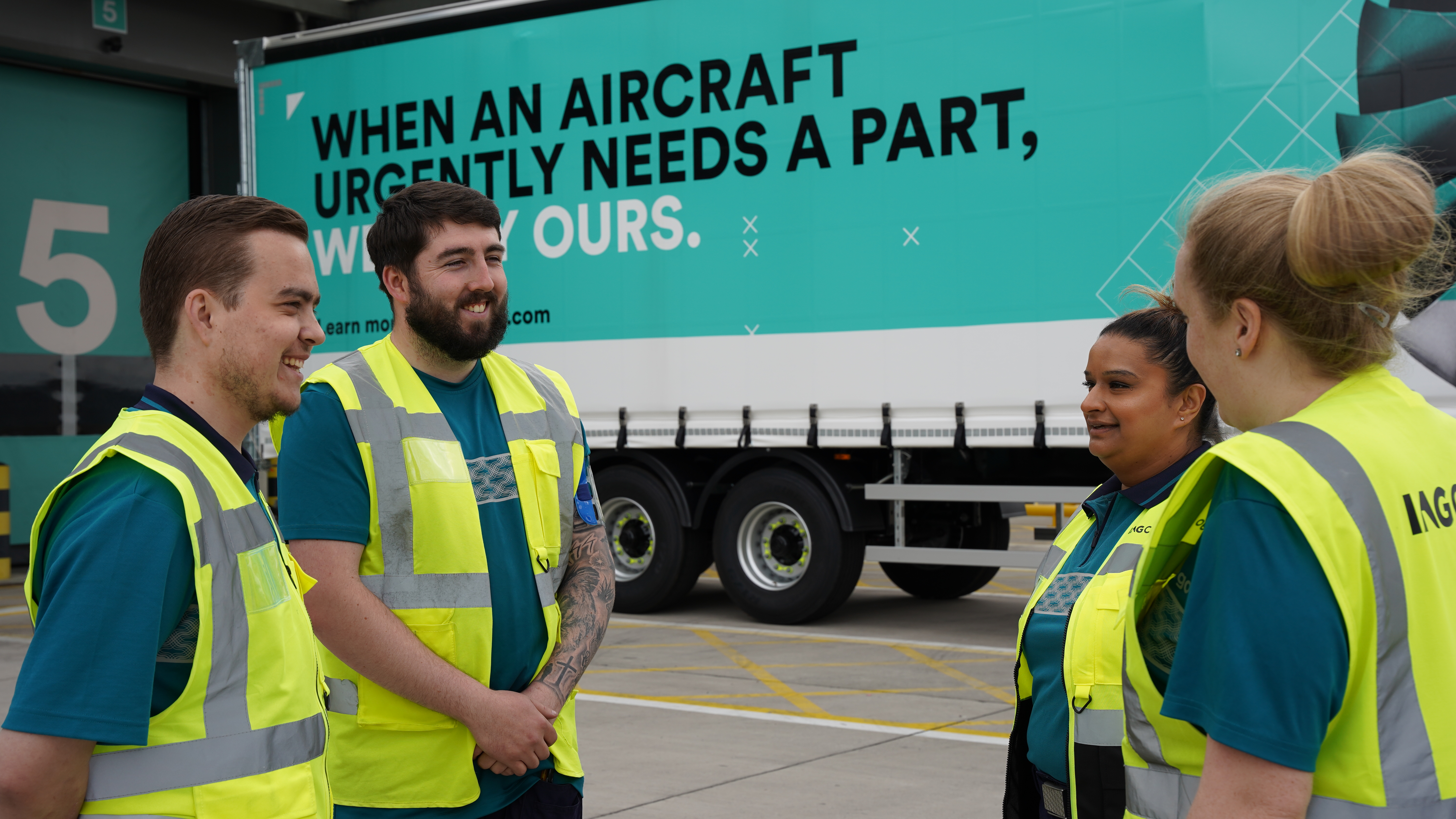 IAG Cargo staff standing near truck 3