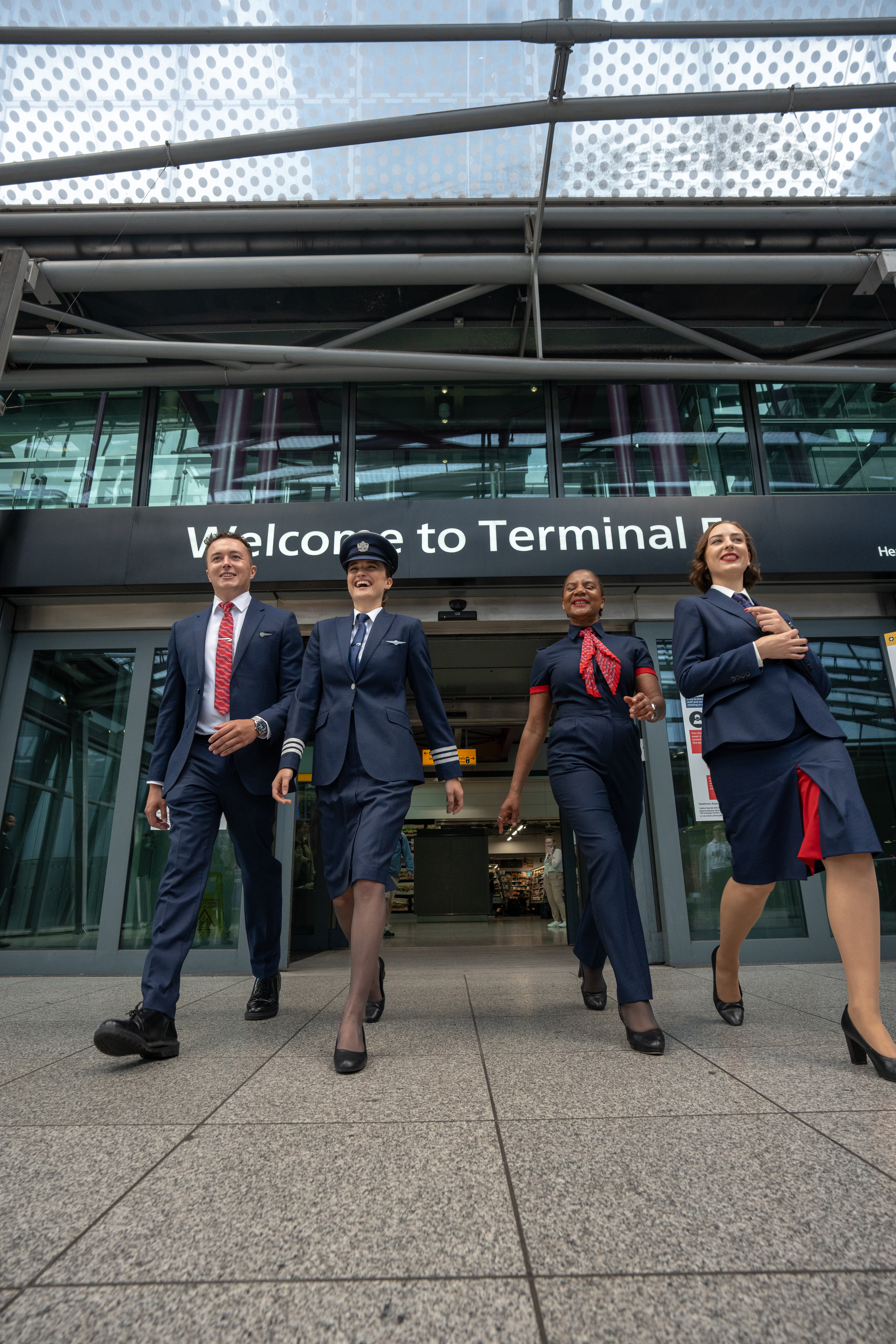 British Airways staff walking near Heathrow terminal building