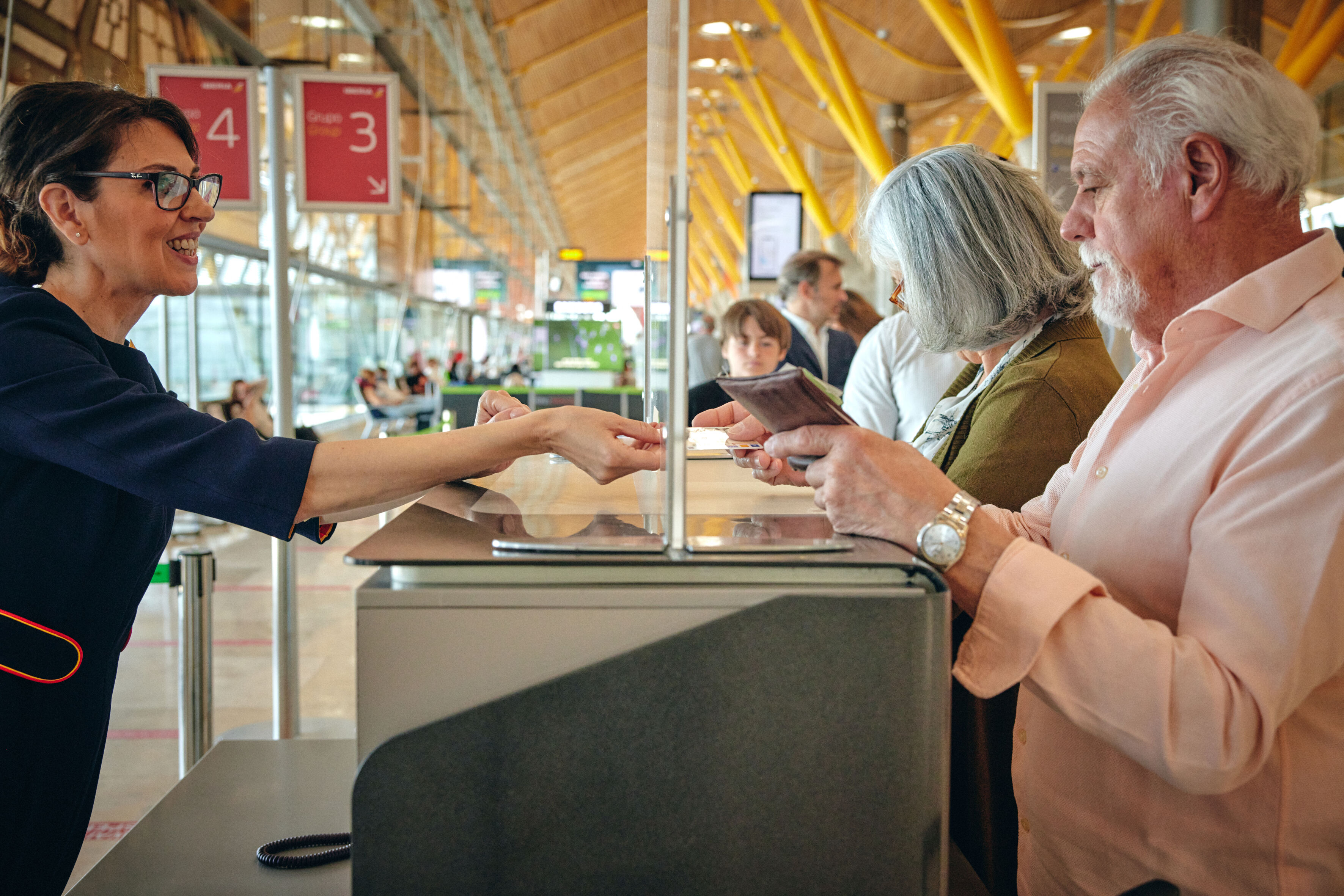 Customers at Iberia check-in desk