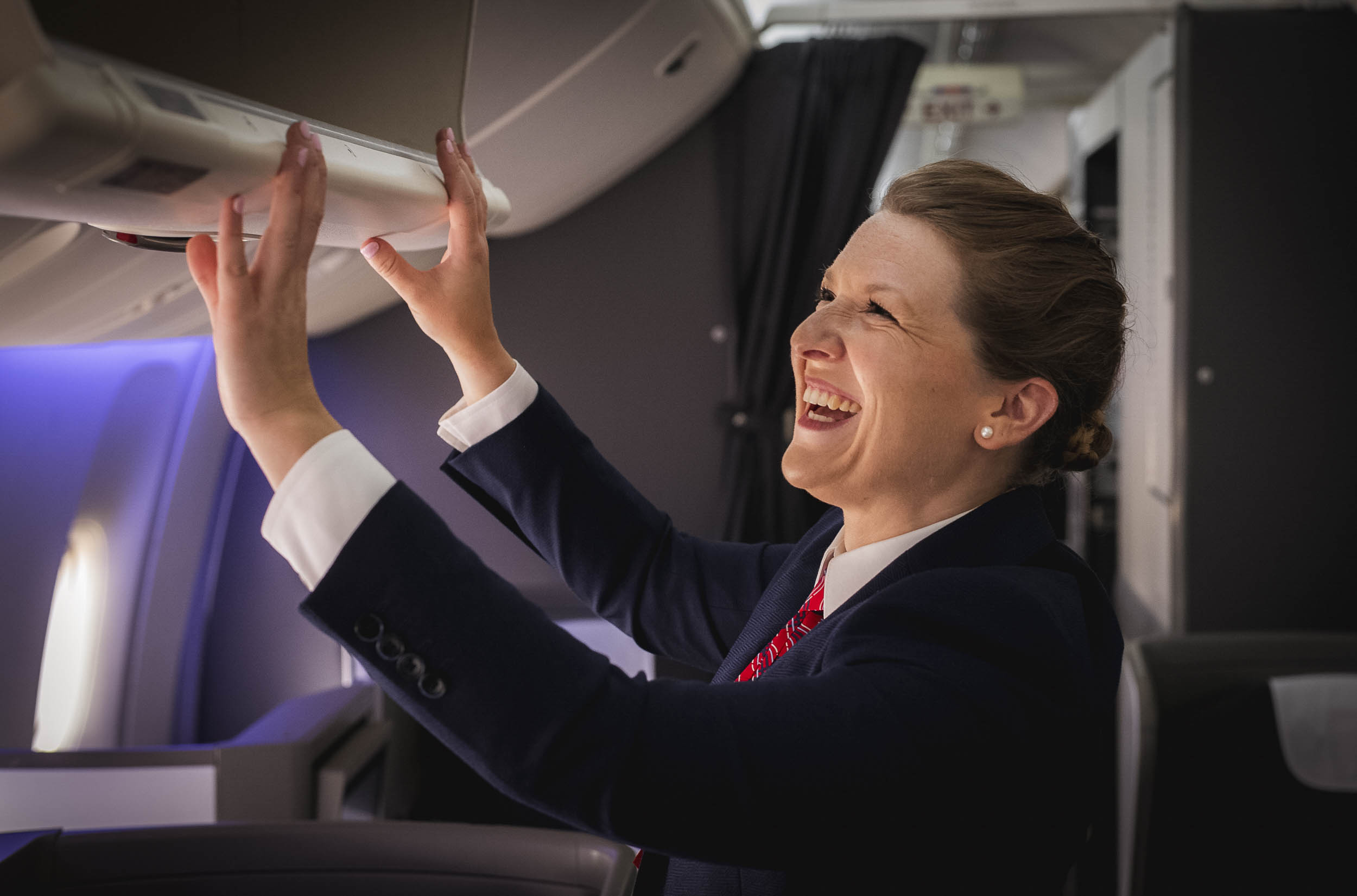 British Aiways cabin crew member on board plane