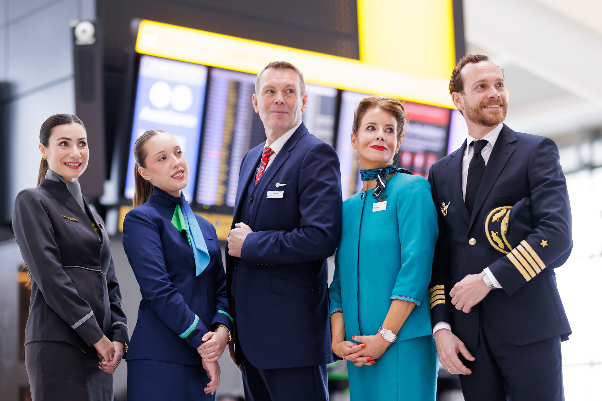 Members of IAG airlines' cabin crew and pilot posing