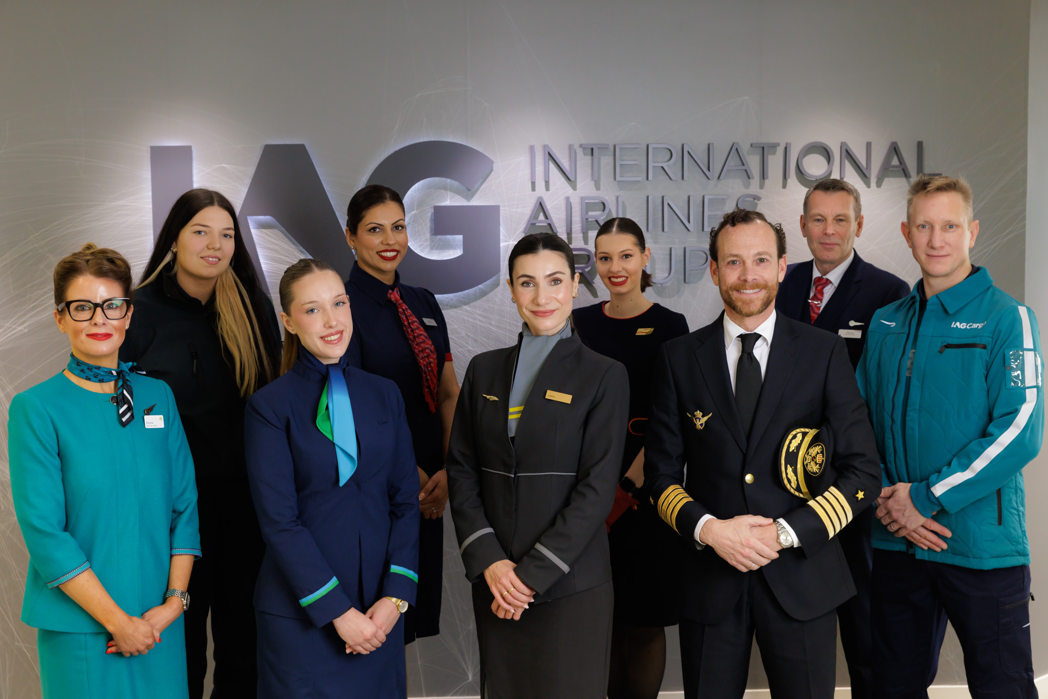 Staff from our airlines and IAG Cargo posing in front of logo